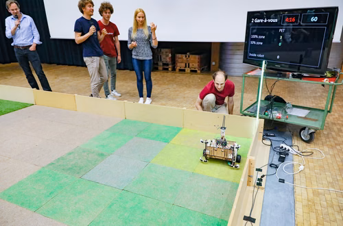 During the STI robot competition, five teams of three master students from different sections of the STI faculty have to design, build and program a cleaning robot. The realized robots must be able to autonomously move in a 64 m² arena that features obstacles and different terrains, while detecting and gathering empty PET bottles, which should then be brought to a specific recycling area. The competition is implemented as a regular semester project during the spring semester.
