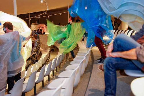 Parade - an artistic performance by Emmanuelle Antille, More than 70 shimmering costumes will be paraded by musicians, dancers, singers and extras. The parade will take place in silence through the hallways of the Rolex Learning Center and then finish to the sound of tambourines and music in the Forum.